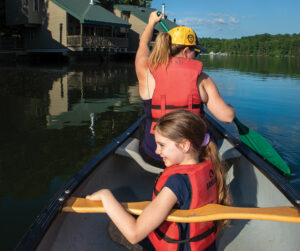 Paddlers pass by Fisherman Cabins and Villas while on the lake at Fall Creek Falls State Park near Spencer. ©Journal Communications/Nathan Lambrecht