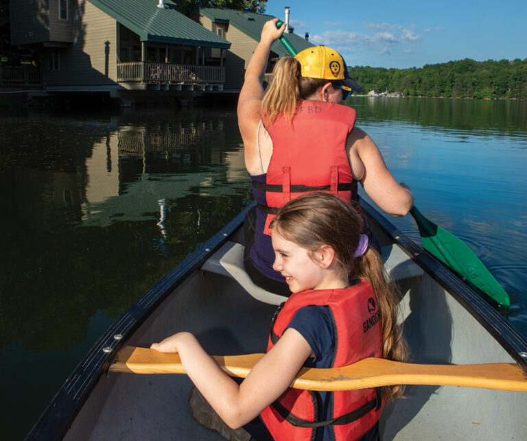 Paddlers pass by Fisherman Cabins and Villas while on the lake at Fall Creek Falls State Park near Spencer. ©Journal Communications/Nathan Lambrecht