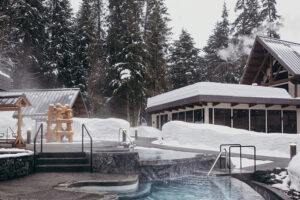 The relaxation pool at the Alyeska Nordic Spa surrounded by snow. The spa is one of the best under the radar spas in the U.S. and is in Girdwood, Alaska.