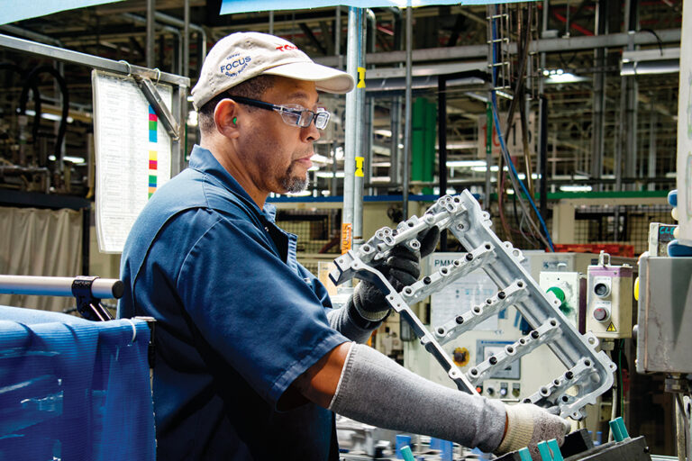 Henry "Sonny" Smith, a Toyota West Virginia team member for 17 years, inspects the cam housing on a 4-cylinder engine. The Toyota Motors plant is located in the Advantage Valley region of West Virginia.