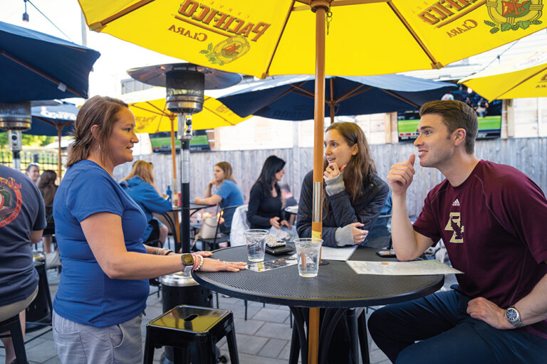 People dine at the Pour Yard in Quincy, MA.