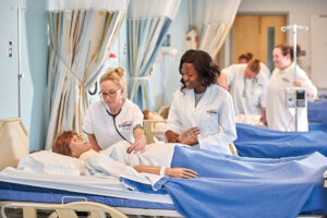 Nurses practice on a dummy at the Bridge Valley CTC, which is located in the Advantage Valley region of West Virginia.