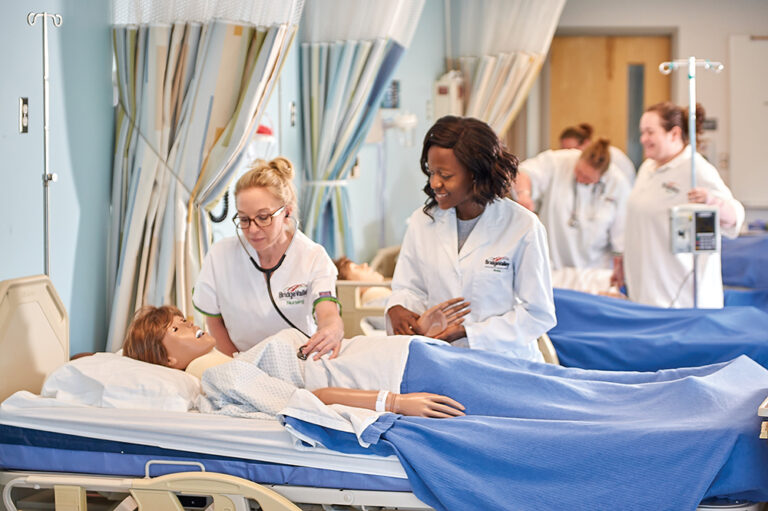Nurses practice on a dummy at the Bridge Valley CTC, which is located in the Advantage Valley region of West Virginia.