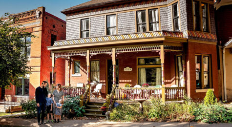 The Reilly family in front of the historic home they are restoring in St. Joseph, MO