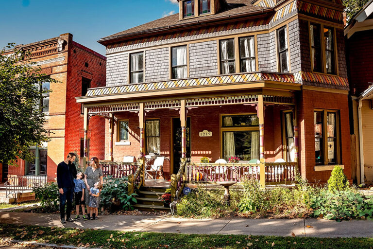 The Reilly family in front of the historic home they are restoring in St. Joseph, MO