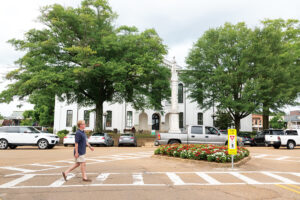 Scenes from Oxford, Mississippi - A man walking through the downtown square.