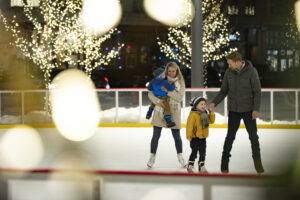 Family on a skating rink. North Dakota is a great place to raise a family.