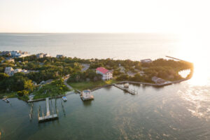 Aerial view of Silver Lake harbor and Ocracoke village on Ocracoke Island, North Carolina at golden hour.