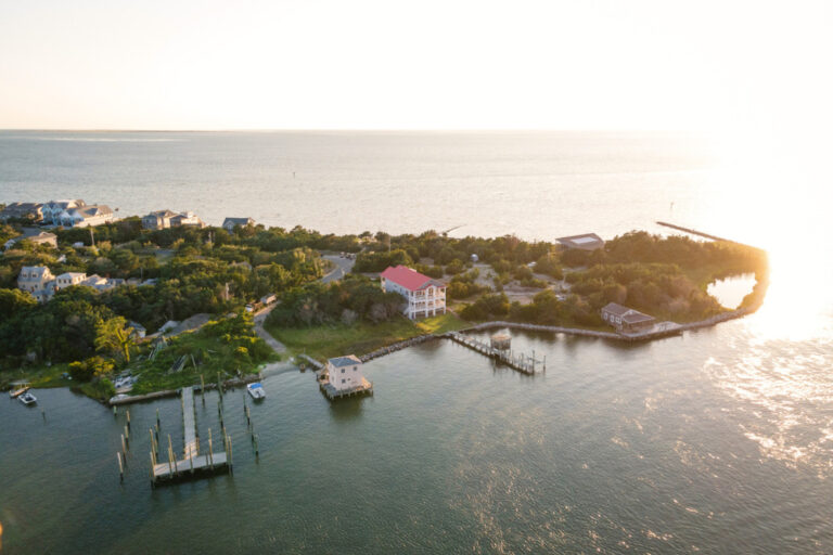 Aerial view of Silver Lake harbor and Ocracoke village on Ocracoke Island, North Carolina at golden hour.