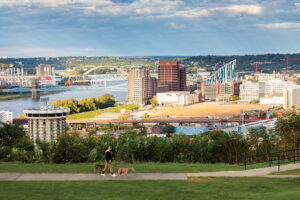 People watch the sunset over Covington and the Ohio River from Devou Park in Covington. Covington is part of the Northern Kentucky Region.