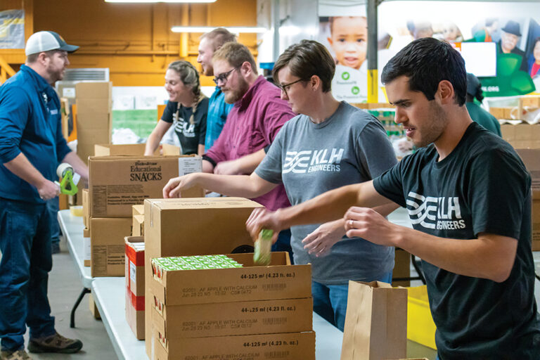 Volunteers from KLK Engineers work in a food pantry in Northern Kentucky.