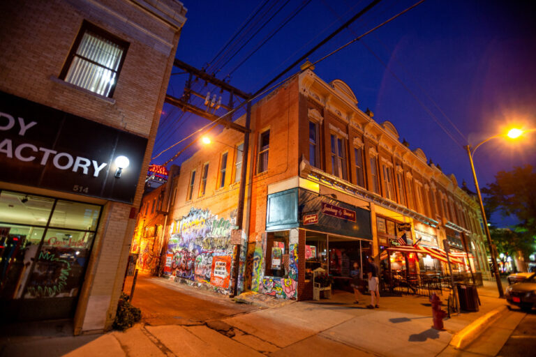 Rapid City, South Dakota - Street corner with bars open late night, few people in the street. Rapid City is a great place for military families to live.