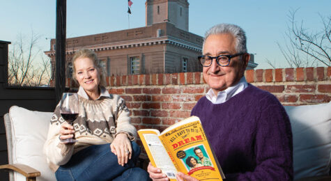 Del and Carolyn Bryant enjoy the balcony of the short-term rental they own, All I Have to Do is Dream.