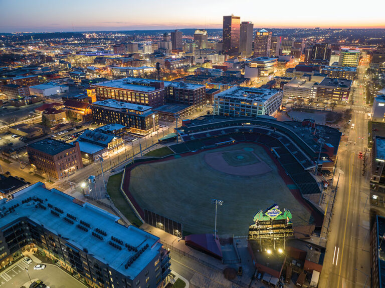 The Delco building (with water tower on top) and new AC Hotel can be seen next to the Day Air Ballpark at dusk in downtown Dayton, OH.