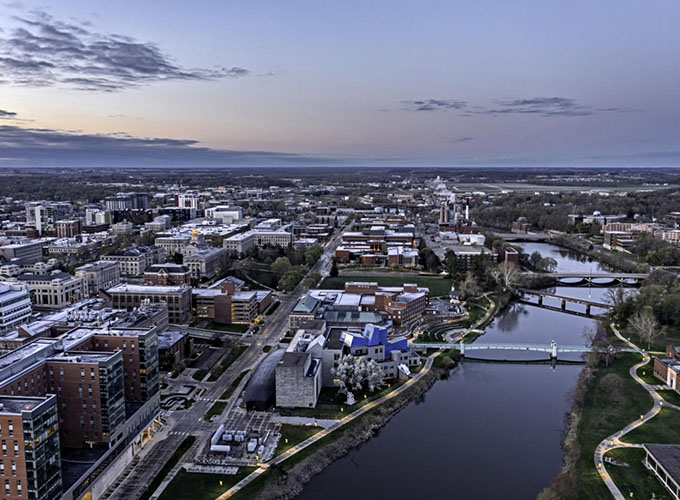 An aerial view of the University of Iowa in Iowa City, IA, at sunrise. As one of the best places to live in the U.S., Iowa City has safe communities, leading education institutions and access to top-notch health care.