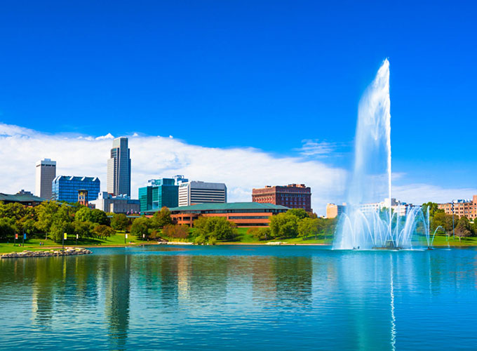 A view of the downtown Omaha skyline from the lake at the new Heartland of America Park. Best-in-class parks, a strong economy, good schools and quality health care make Omaha, NE, one of the best places to live in the U.S.