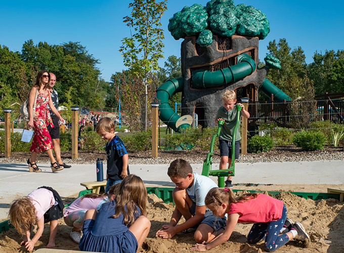 Children play in a sandbox at one of Rochester Hills, MI's many parks. Rochester Hills, a suburb of Detroit, is one of the best places to live in the US in 2023.