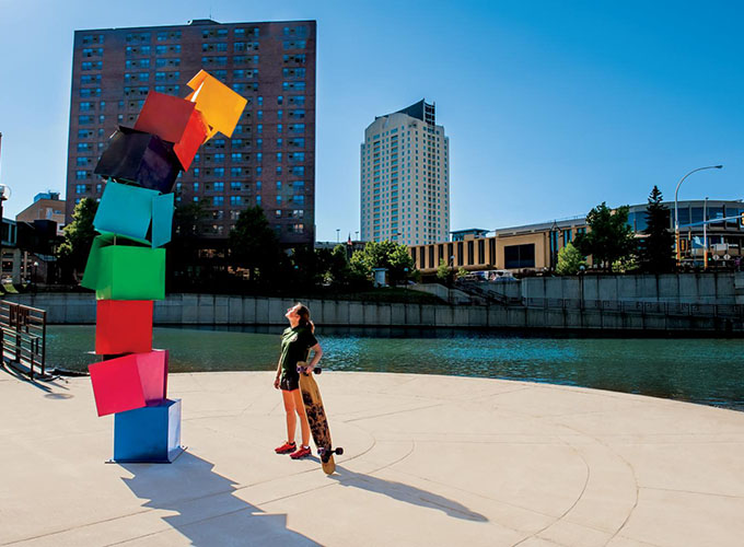 A woman looks at a colorful art installation along the bike trails near downtown Rochester, MN.  Known as the home of the Mayo Clinic, Rochester is also one of the best places to live in the U.S. in 2023.