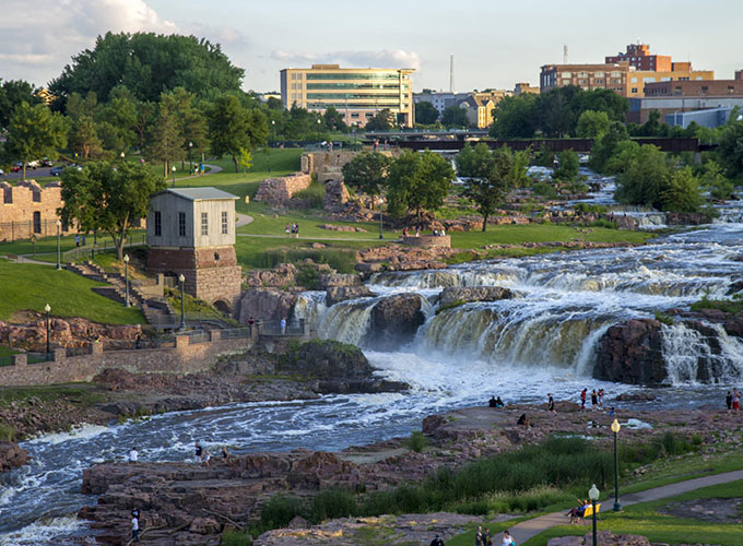 Family-friendly amenities, including more than 80 parks, make Sioux Falls, SD, one of the best places to live in the U.S. Falls Park, shown here, is a key attraction in the heart of the city.