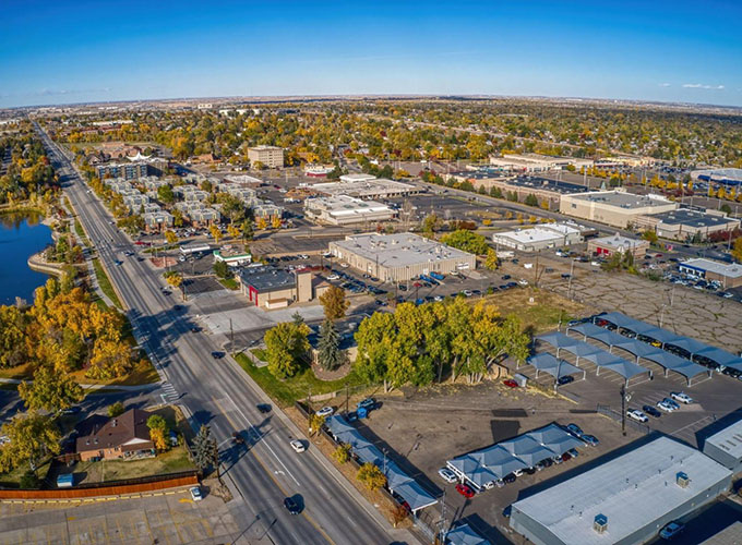 An aerial shot of Thornton, CO, a Denver suburb, during autumn. Thornton has gorgeous mountain scenery and a wide range of outdoor activities as well as plentiful parks.