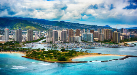 The beautiful coastline Honolulu Hawaii shot from an altitude of about 500 feet during a helicopter photo flight over the Pacific Ocean.