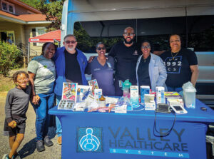 Dr. Kimberly Brown-Gullatt (middle) at an event.
