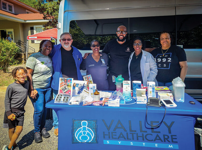 Dr. Kimberly Brown-Gullatt (middle) at an event.