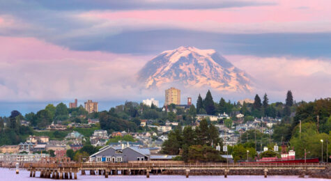 Mount Rainier over Tacoma, Washington waterfront during alpenglow sunset evening.