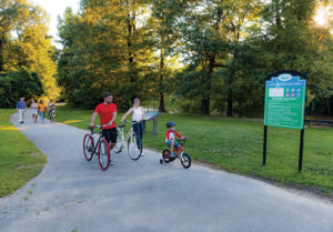 Family bikes along the Neuse River in the Triangle East Region of North Carolina.